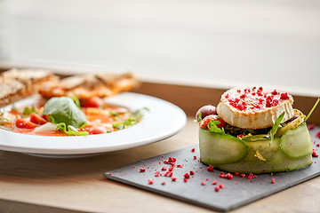 Image showing goat cheese salad and gazpacho soup at restaurant