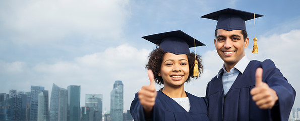 Image showing students or bachelors showing thumbs up over city