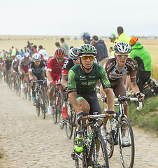 Image showing The Peloton on a Cobblestone Road - Tour de France 2015