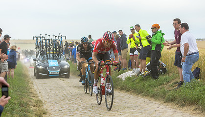 Image showing Two Cyclists on a Cobblestone Road - Tour de France 2015