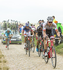 Image showing The Peloton on a Cobblestone Road - Tour de France 2015