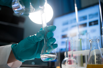 Image showing Lab assistant in rubber gloves