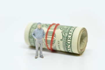 Image showing Figure of businessman and one dollar bill