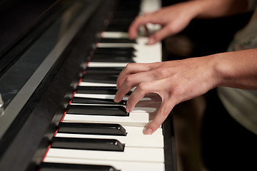 Image showing close up of hands playing piano