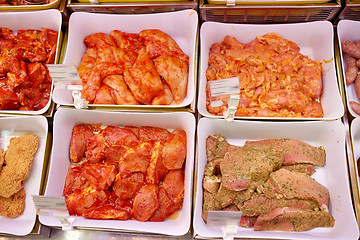 Image showing marinated meat in bowls at grocery stall