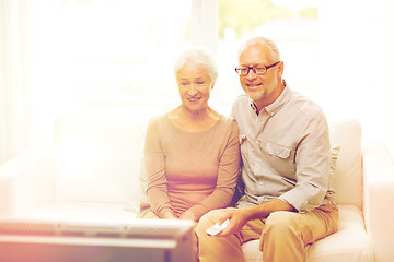 Image showing happy senior couple watching tv at home