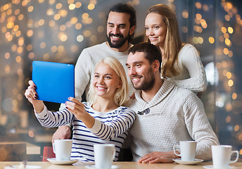 Image showing happy friends with tablet pc taking selfie at cafe