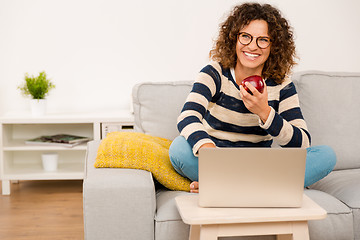 Image showing Beautiful woman working at home