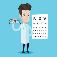 Image showing essional ophthalmologist holding eyeglasses.