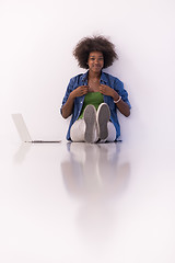 Image showing african american woman sitting on floor with laptop