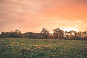 Image showing Countryside sunset with orange colors in the sky