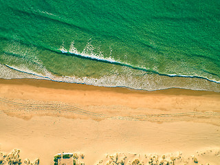 Image showing Aerial View Amazing Seascape with Small Waves on Sandy Beach