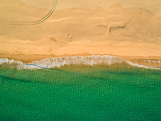 Image showing Aerial View Amazing Seascape with Small Waves on Sandy Beach