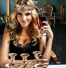 Image showing young blond woman wearing crown in fairy luxury interior with em