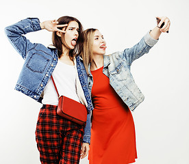 Image showing best friends teenage girls together having fun, posing emotional on white background, besties happy smiling, lifestyle people concept 