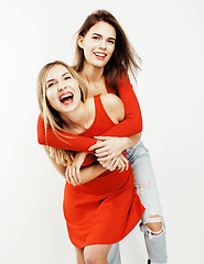 Image showing best friends teenage girls together having fun, posing emotional on white background, besties happy smiling, lifestyle people concept 