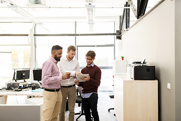 Image showing business team with tablet pc and coffee at office