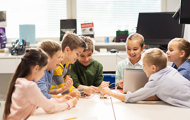 Image showing happy children with laptop at robotics school