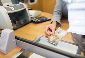 Image showing clerk with swiss francs cash money at bank office