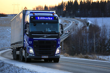 Image showing Blue Volvo FH Cargo Truck Transport at Sunset 