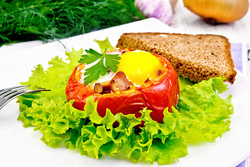 Image showing Scrambled eggs in tomato and bread on light board