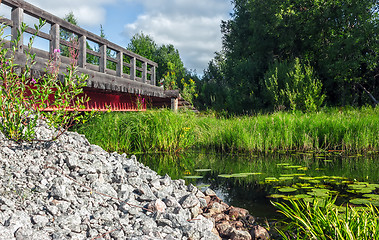 Image showing Wooden Bridge Over The River