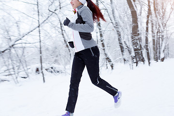 Image showing Young woman running in morning