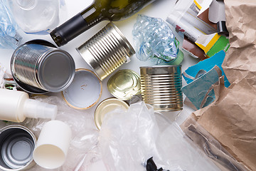 Image showing Trash lies on white table