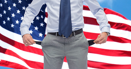 Image showing american businessman with empty pockets