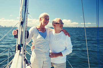 Image showing senior couple hugging on sail boat or yacht in sea