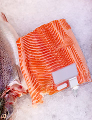 Image showing salmon fish fillet on ice at grocery