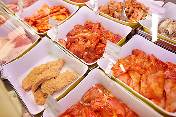 Image showing marinated meat in bowls at grocery stall