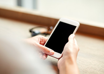 Image showing close up of woman texting on smartphone