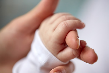 Image showing close up of mother and newborn baby hands