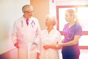 Image showing medics and senior patient woman at hospital