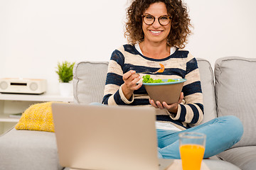 Image showing Beautiful woman eating a salad