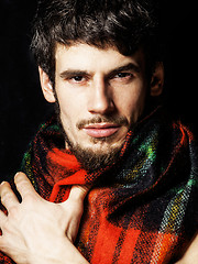 Image showing portrait of handsome man warmed up in scarf christmas colored