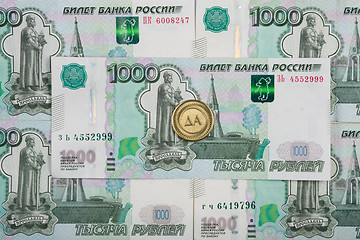 Image showing On thousandth bill Russian rubles coin is \