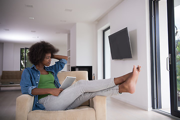 Image showing african american woman at home with digital tablet