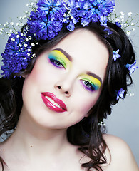 Image showing Beauty young woman with flowers and make up close up, real spring beauty