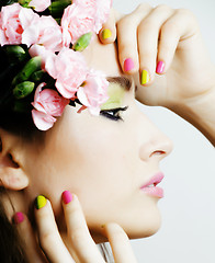 Image showing Beauty young woman with flowers and make up close up