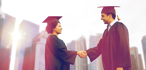 Image showing happy students or bachelors greeting each other