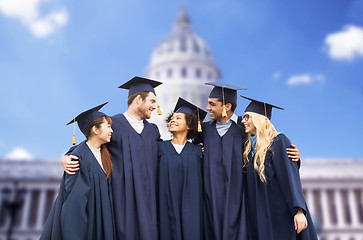 Image showing happy students or bachelors in mortar boards