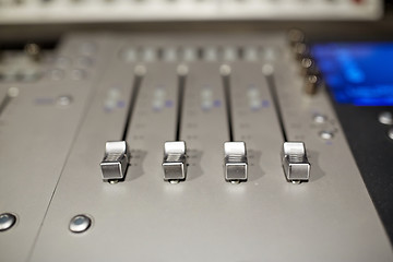 Image showing music mixing console at sound recording studio