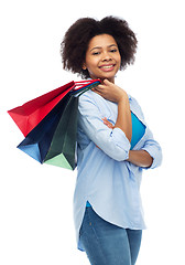 Image showing smiling afro american woman with shopping bags