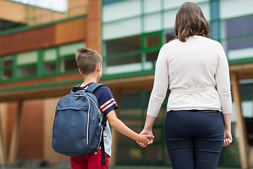 Image showing elementary student boy with mother at school yard