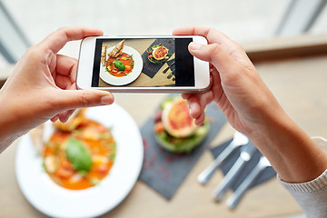 Image showing hands with smartphone photographing food