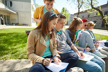 Image showing group of students with notebooks at school yard