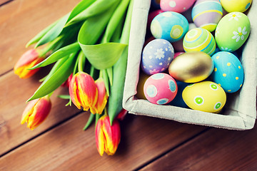 Image showing close up of colored easter eggs and flowers