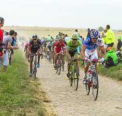 Image showing The Peloton on a Cobblestone Road - Tour de France 2015